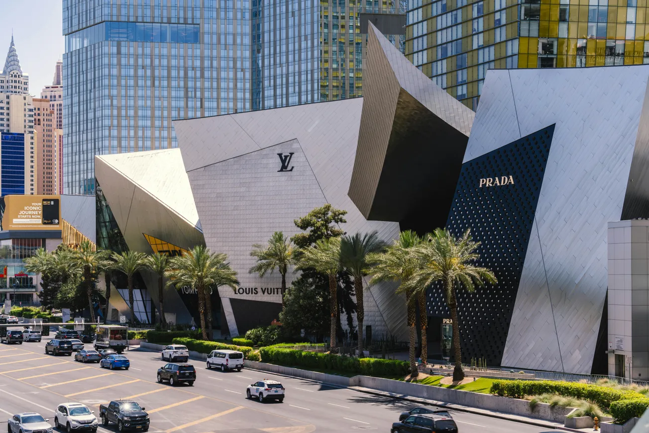 Luxury retail architecture in Las Vegas featuring Louis Vuitton and Prada flagship stores, showcasing experiential design and premium shopping destinations.