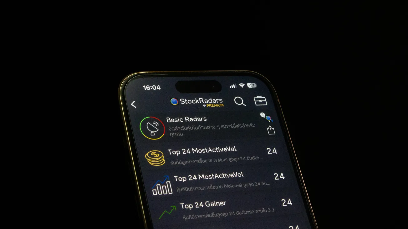 Alt text: Smartphone displaying StockRadars app interface with categories like Basic Radars and Top 24 Most Active Val.
