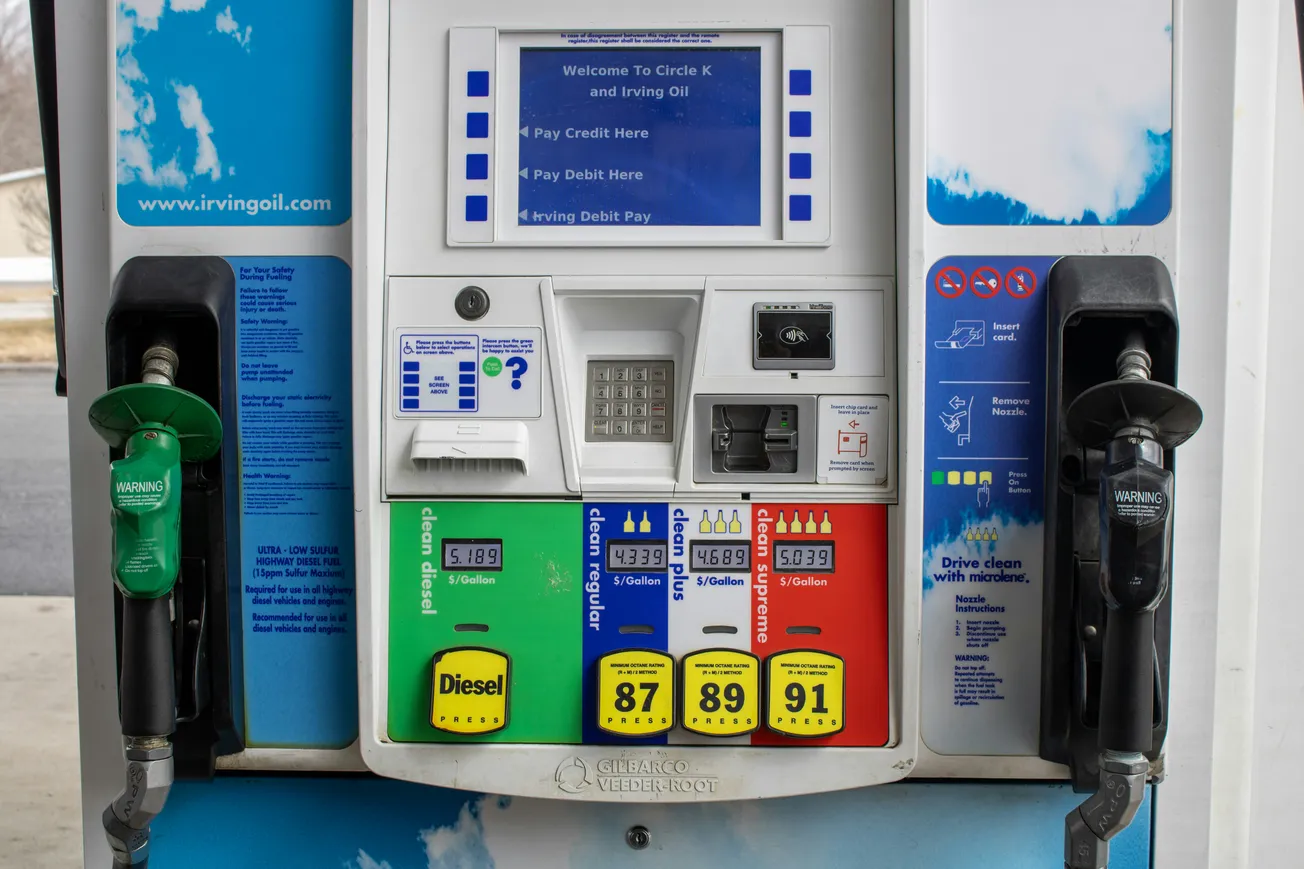 Gas station pump with diesel and three gasoline options: 87, 89, 91 octane. Displays prices per gallon. Keypad and card payment slots are visible.